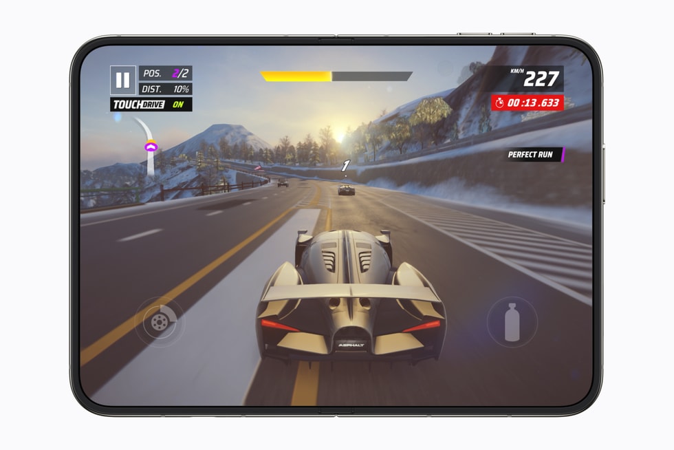 A fully flat open iPhone Duo shows the game Asphalt Legends.
