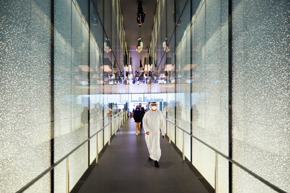 Guests entering through The Galleria Al Maryah Island walk through a mirrored tunnel.