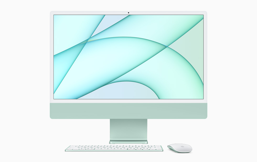 iMac باللون الأخضر مع لوحة مفاتيح Magic Keyboard وMagic Mouse بلون الجهاز نفسه.