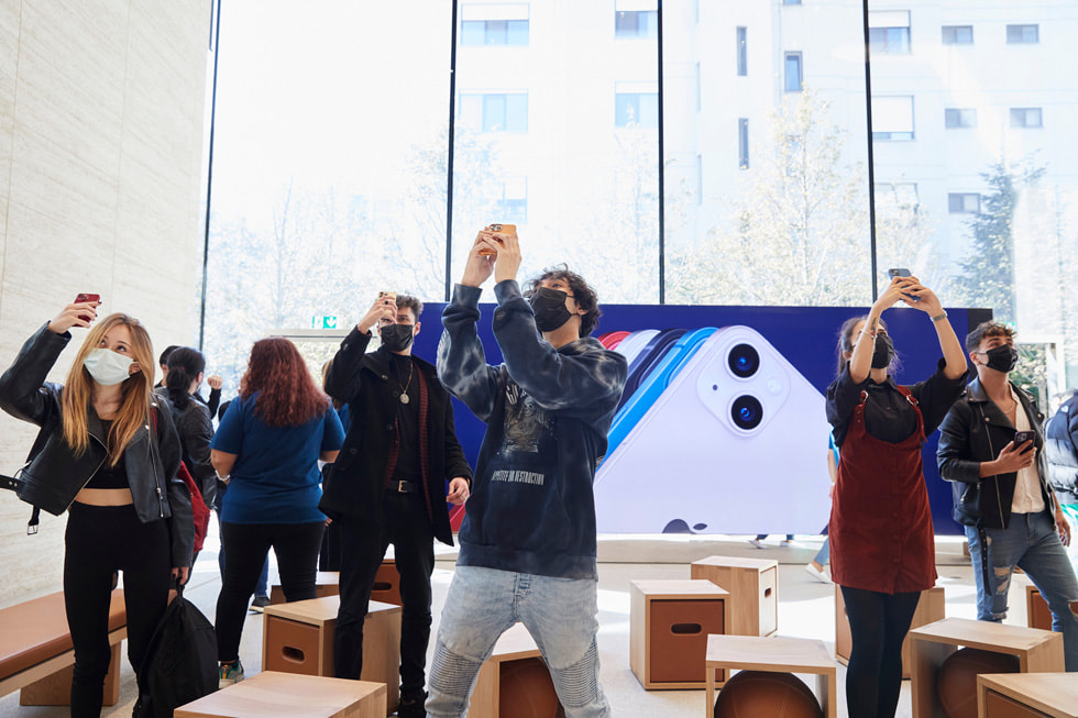 Customers take photos of the new Apple Store in the heart of Istanbul.