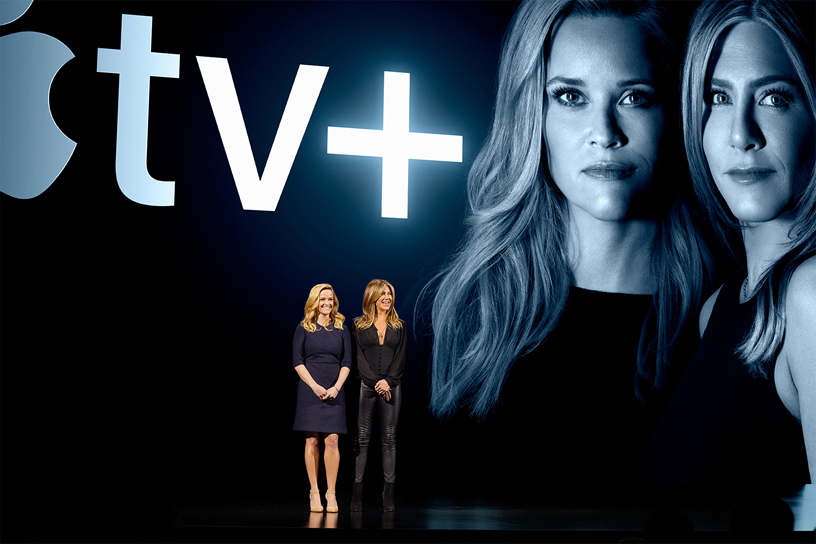 Reese Witherspoon and Jennifer Aniston on stage at Steve Jobs Theater.