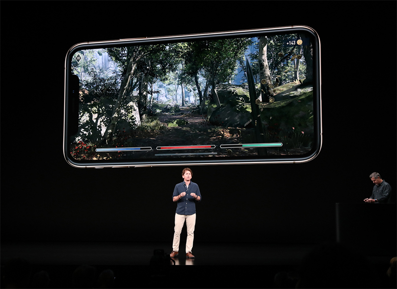 Todd Howard on stage presenting The Elder Scrolls: Blades game demo on iPhone Xs.