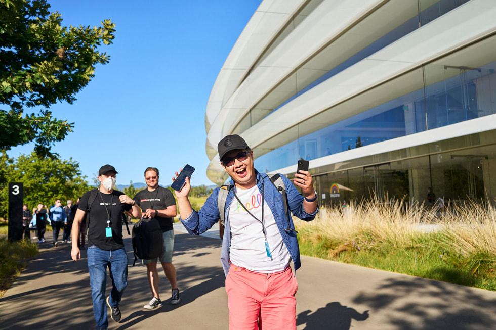 Attendees walk along the outer ring of Apple Park.