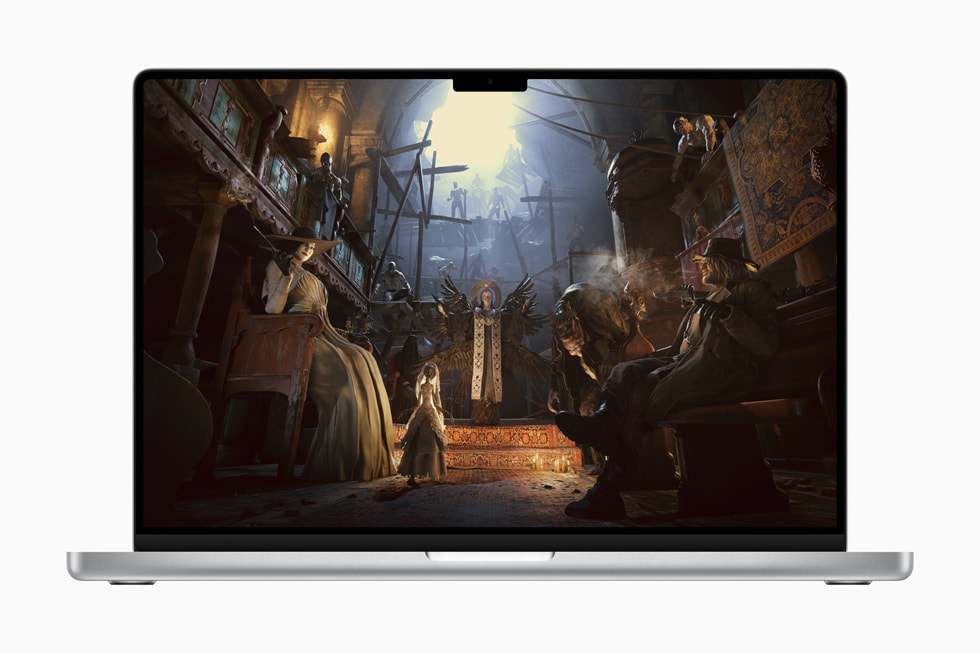 Na displeji MacBooku Pro se zobrazuje hra Resident Evil Village.