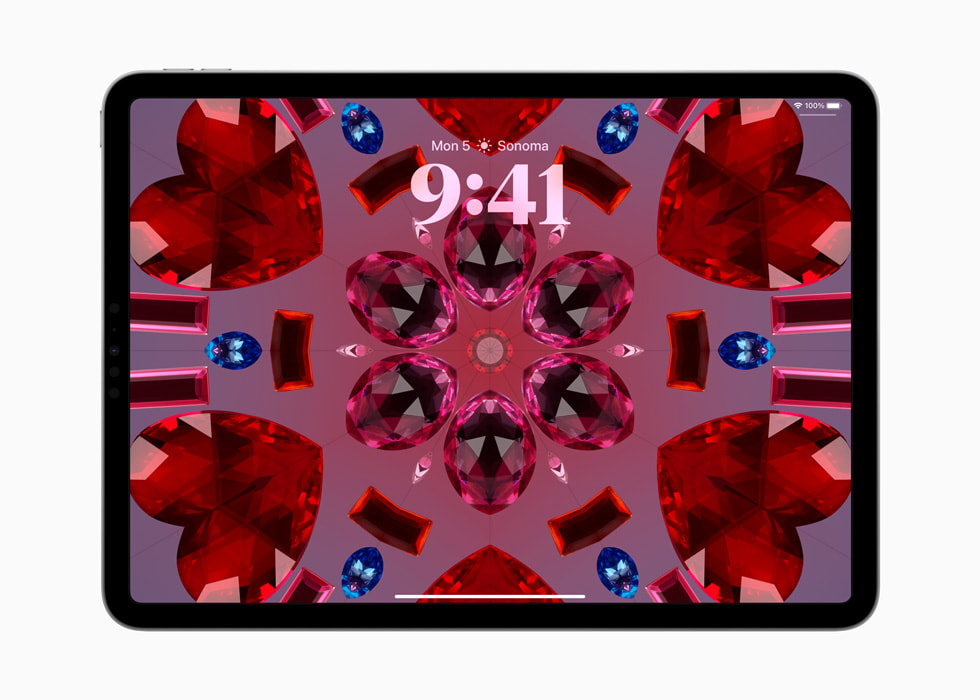 Un iPad Pro affiche le fond d’écran kaléidoscope.