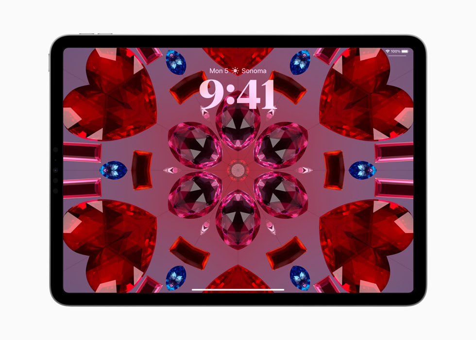 Un iPad Pro con el fondo de pantalla de caleidoscopio.