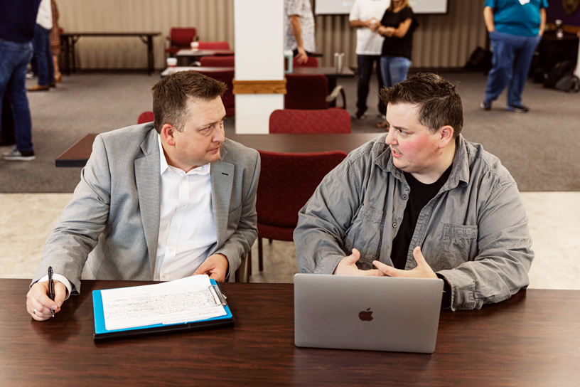 Educators in Austin, Texas reviewing an app on MacBook Pro.