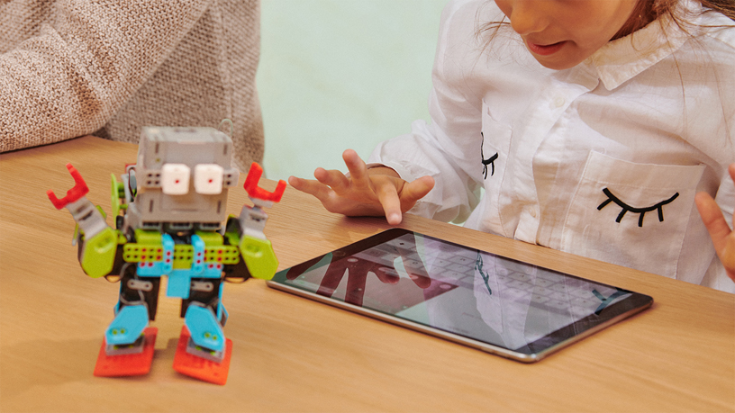 iPad being used to control toy robot.