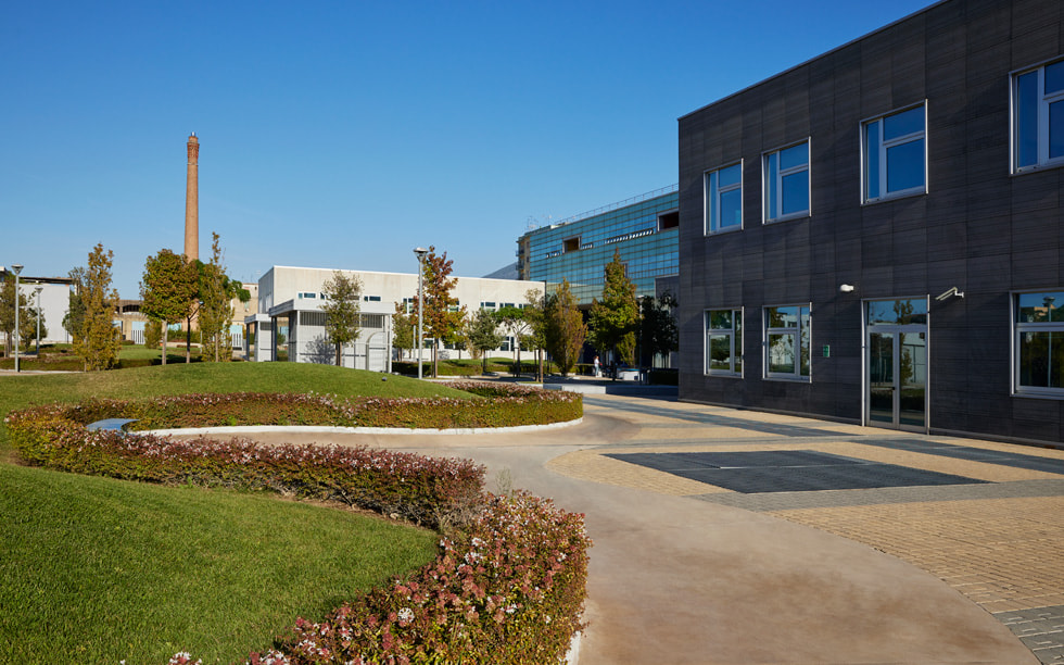 The exterior of the Apple Developer Academy in Naples, Italy, is shown.