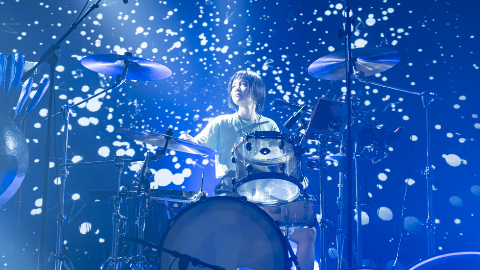 Drummer Shi Lu playing on stage.