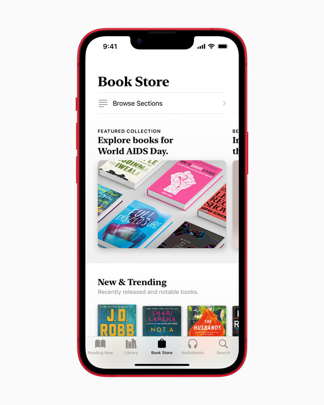 Apple Books' Book Store tab featuring books for World AIDS Day on iPhone 14 in PRODUCT(RED).