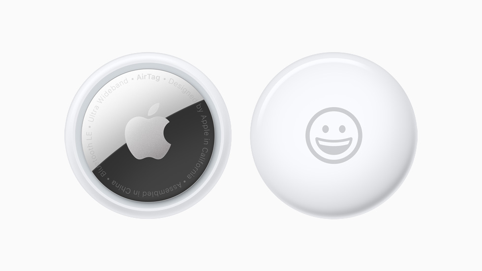Front and back view of AirTag personalized with a smiley-face emoji.