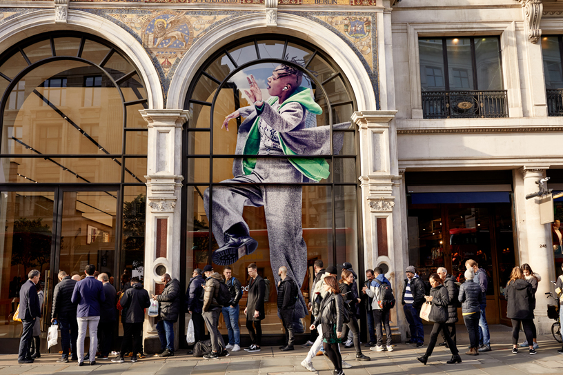 Customers line up outside Apple Regent Street in London.