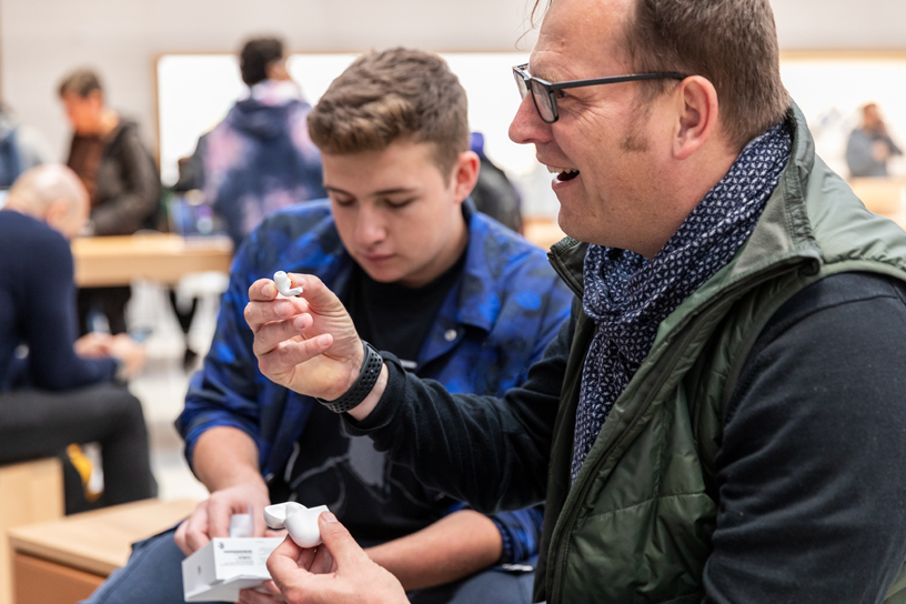 A customer unboxes AirPods Pro at Apple Fifth Avenue in New York.