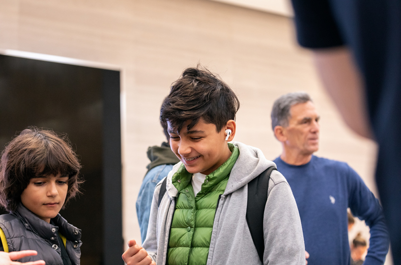 Young customers test out AirPods Pro. 