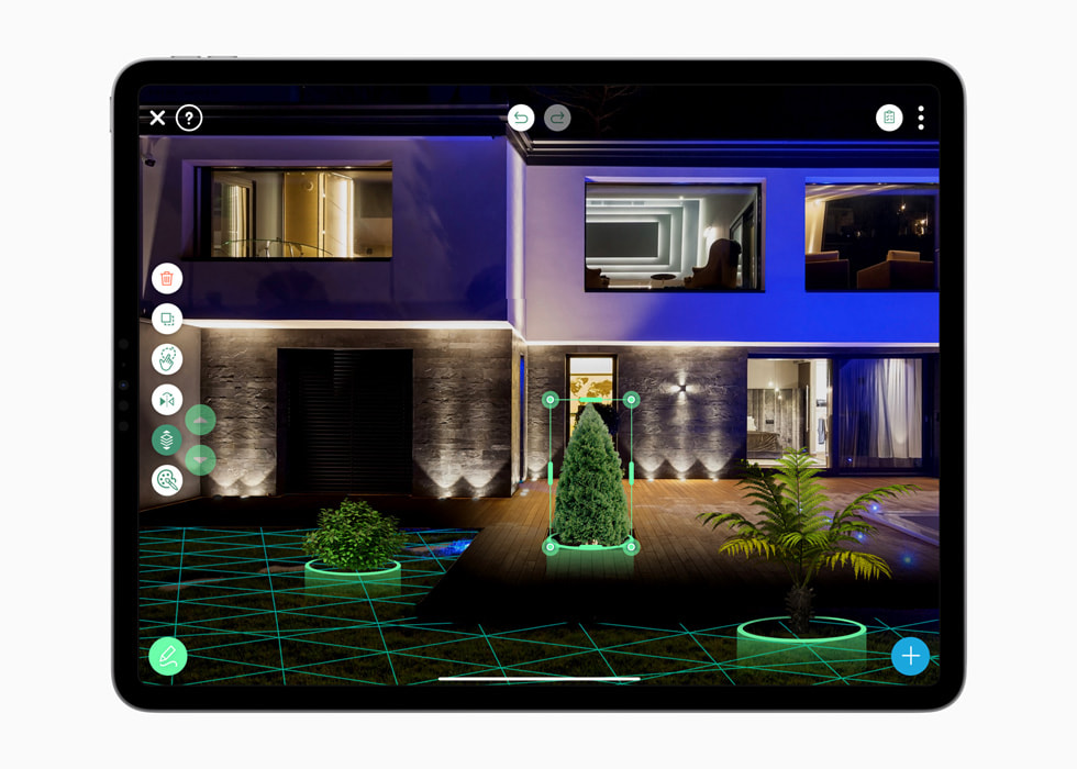 A screen from the iScape app on iPad shows a user playing around with the placement of an evergreen tree.