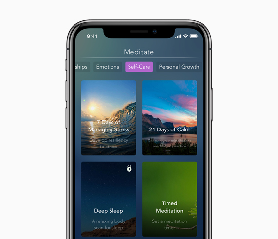 iPhone with Calm meditation app on screen.