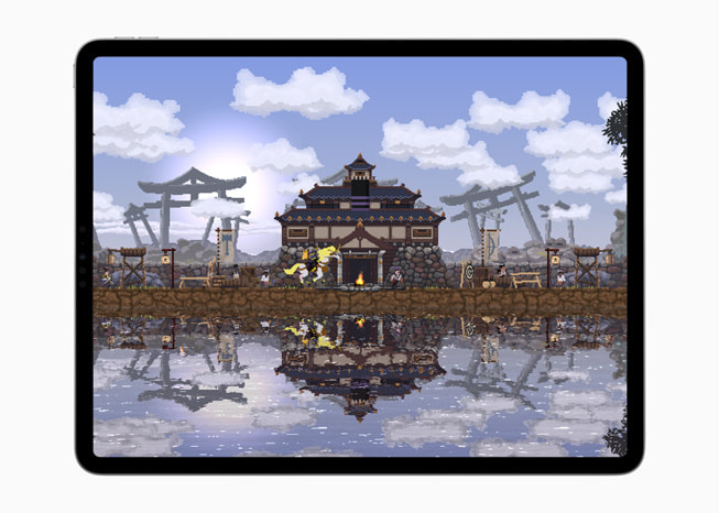 Un’istantanea del gioco Kingdom Two Crowns+ su un iPad Pro che mostra una casa affacciata su una distesa d’acqua.