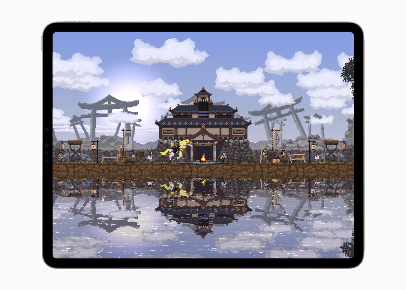 Sur l'iPad Pro, un Still From the Game Kingdom Two Crowns montre une maison à côté d'un plan d'eau