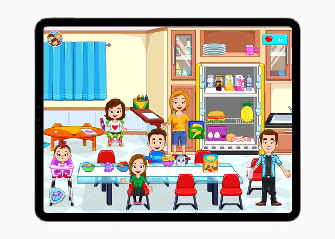 On iPad Pro, a still from the game My Town Home - Family Games+ shows a cartoon family in a kitchen.