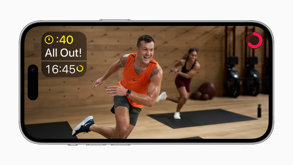 Apple Fitness+ workout session on iPhone 14 Pro.