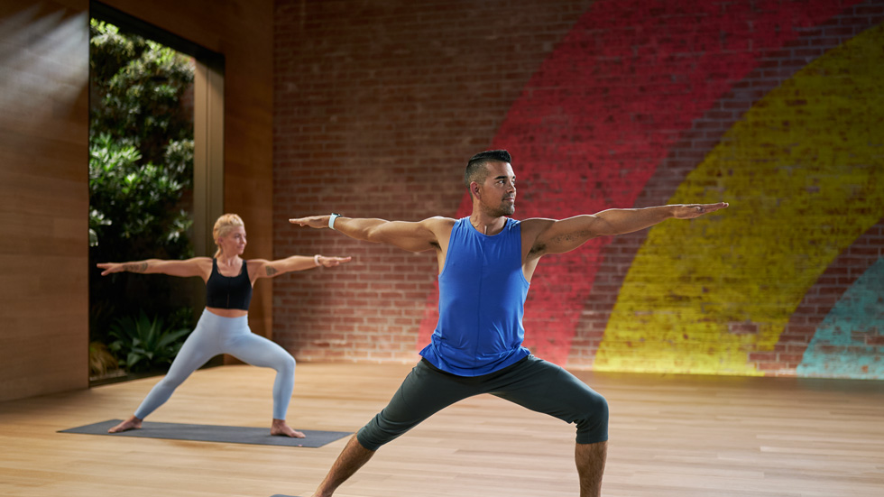 Yoga workout in the Apple Fitness+ studio.