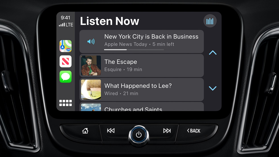The News app in CarPlay is displayed on a car dashboard.