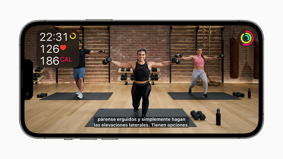 Spanish subtitles in a Fitness+ workout displayed on iPhone 13 Pro.