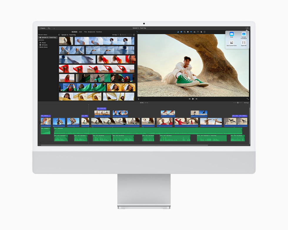 A video project is edited using the iMovie app, displayed on a silver iMac.