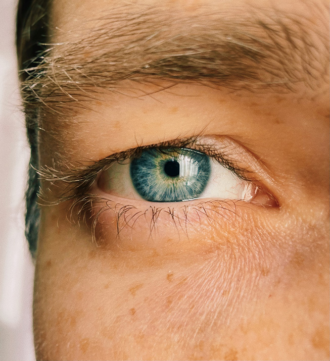 A close-up shot of a person's blue eye.