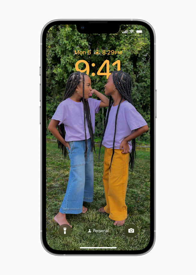 A personalized Lock Screen in iOS 16 shows a user is using their Personal Focus setting.