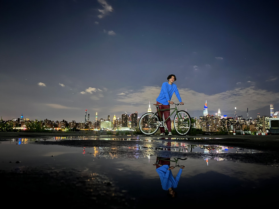 A cyclist photographed in Night mode on iPhone 13. 