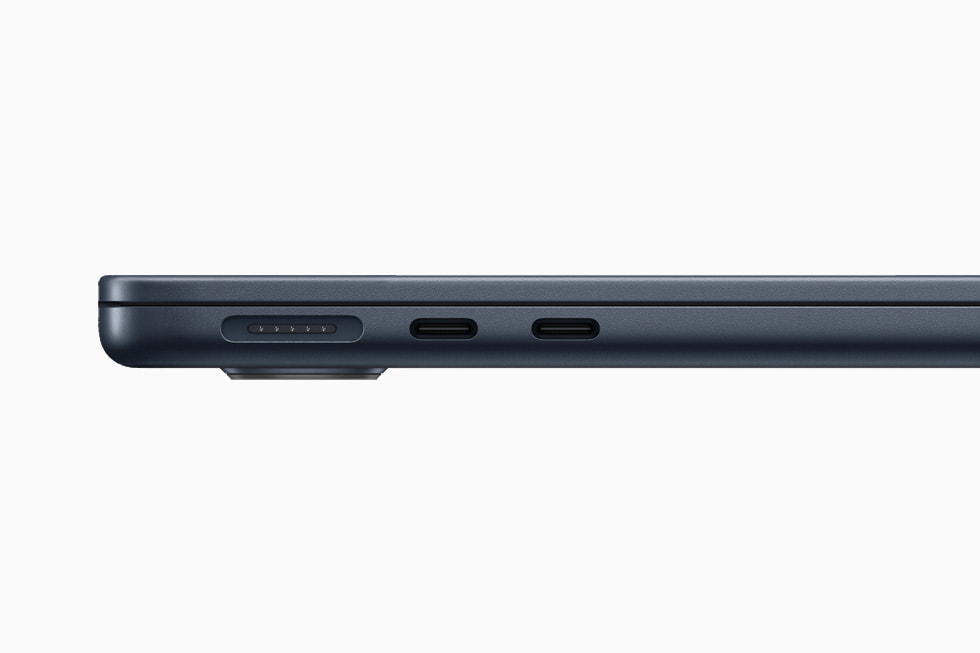 Close-up shot of MacBook Air’s MagSafe and two Thunderbolt ports in midnight.