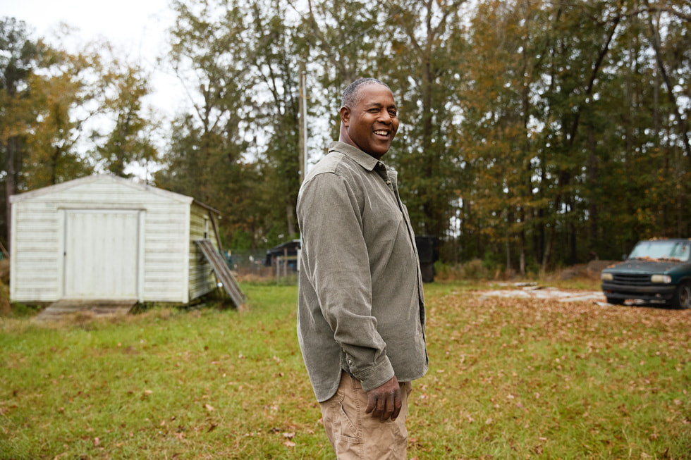 Lloyd Byrd is shown standing outside.