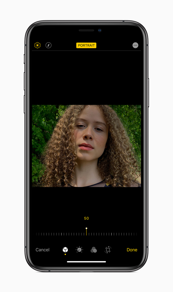 An image of a young woman showcasing Portrait Lighting adjustments in iOS 13. 