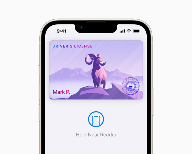 iOS 15 showing a driver’s licence in Wallet on a starlight iPhone 13.