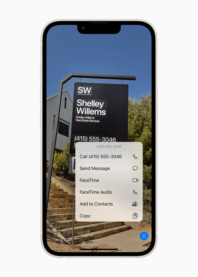 iOS 15’s Live Text using on-device intelligence to identify text on a photo on a starlight iPhone 13.