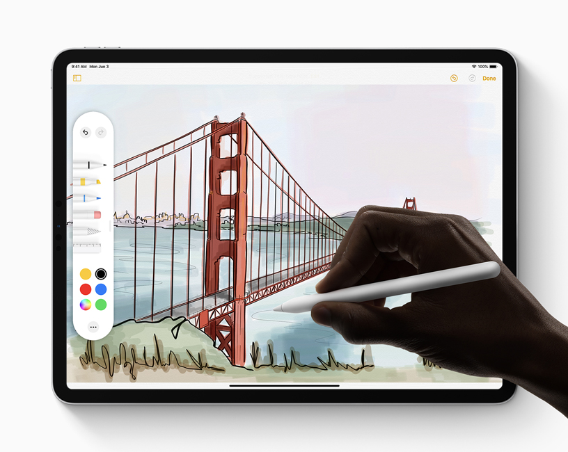 A person using Apple Pencil and the new tool palette to complete a drawing in iPadOS on iPad.