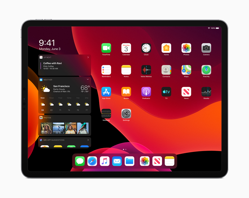 The iPadOS Home screen in Dark Mode.