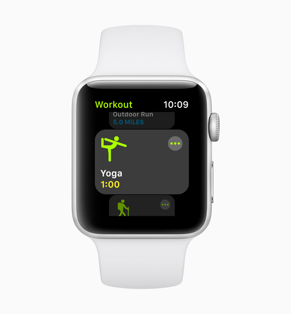 New yoga workout screen displayed on white Apple Watch