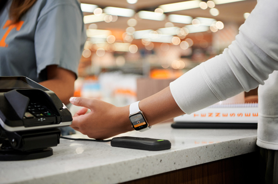 A student uses their ID on Apple Watch at checkout. 