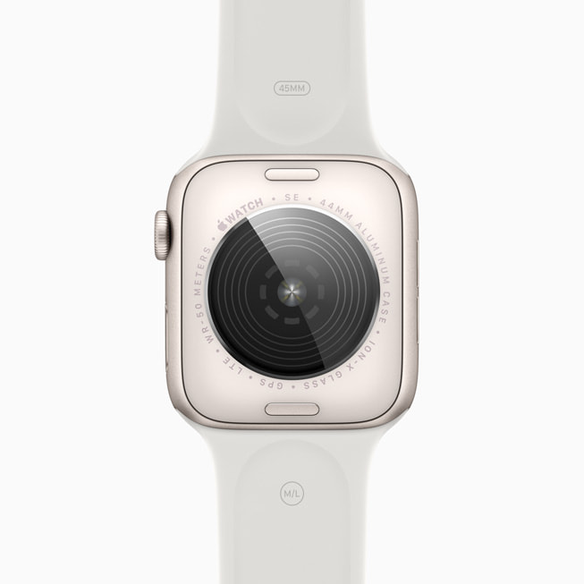 Cubierta posterior, a juego con la caja, rediseñada en el Apple Watch SE blanco estelar.
