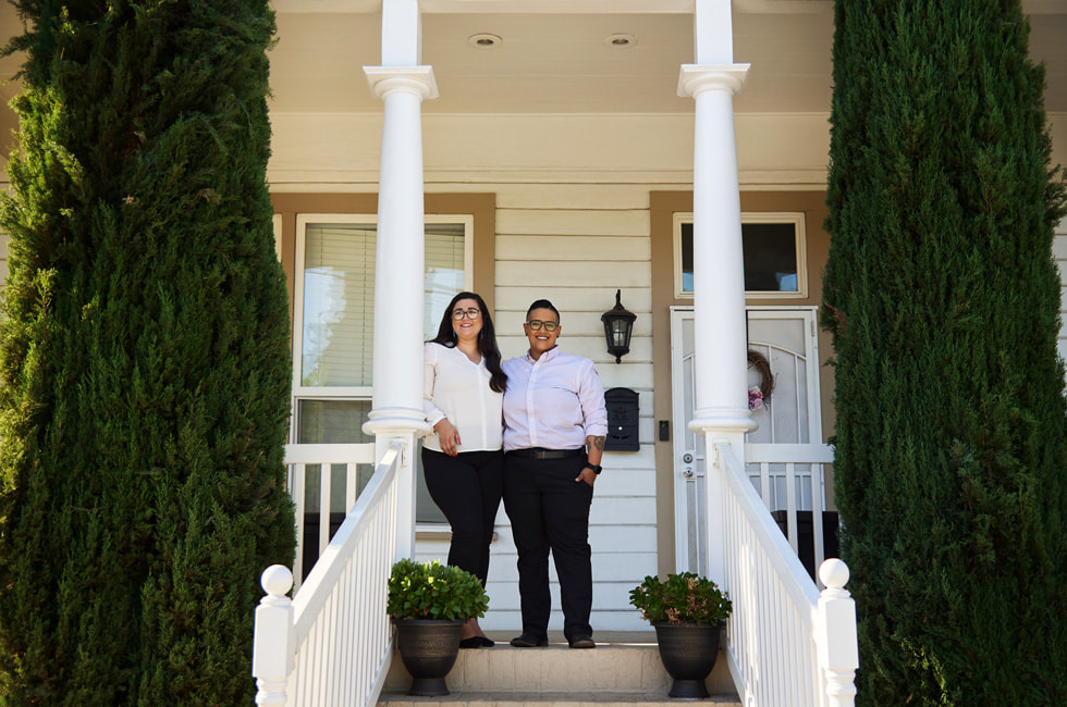 Taylor Mestres and Keteria Lara in front of their new home in Stockton, California.