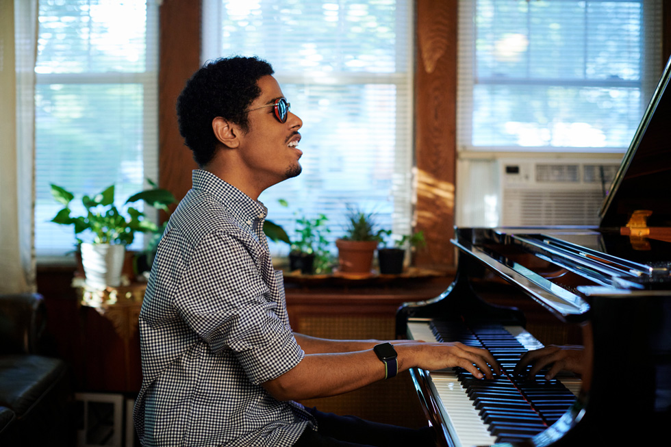 Mathew Whitaker performs on the piano at his home.