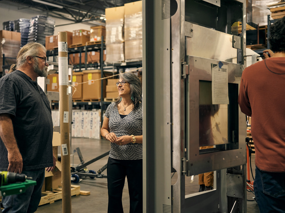 Employees interacting inside Argent Associates’ warehouse.