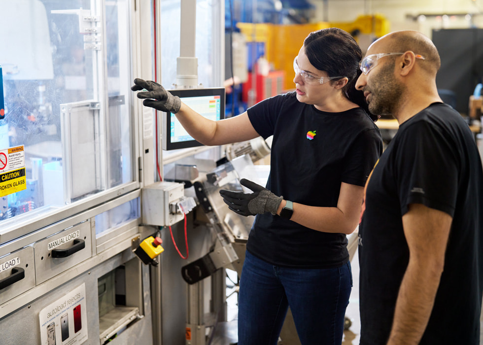 Material Recovery Lab operations leads working on the Daisy disassembly robot. 