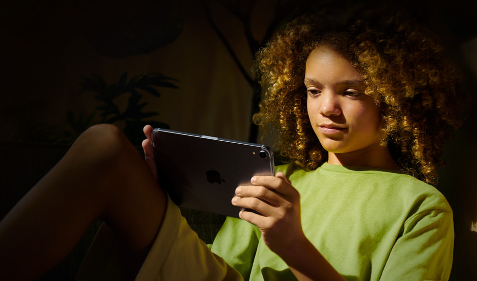 A child holds an iPad.