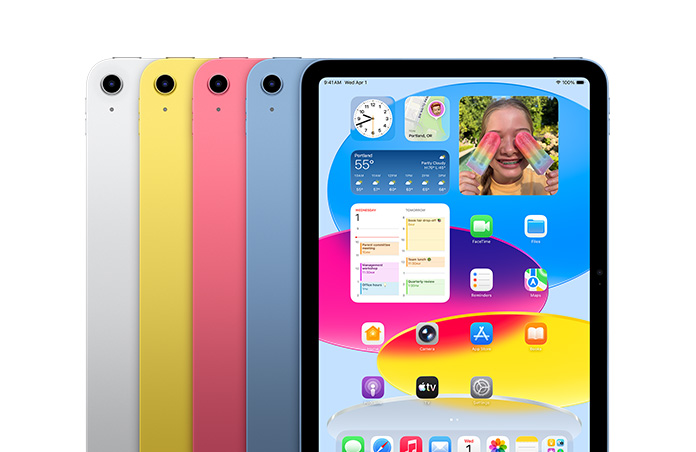 iPad devices lined up in four colors, silver, yellow, pink, blue, while screen shows wallpaper and variety of apps