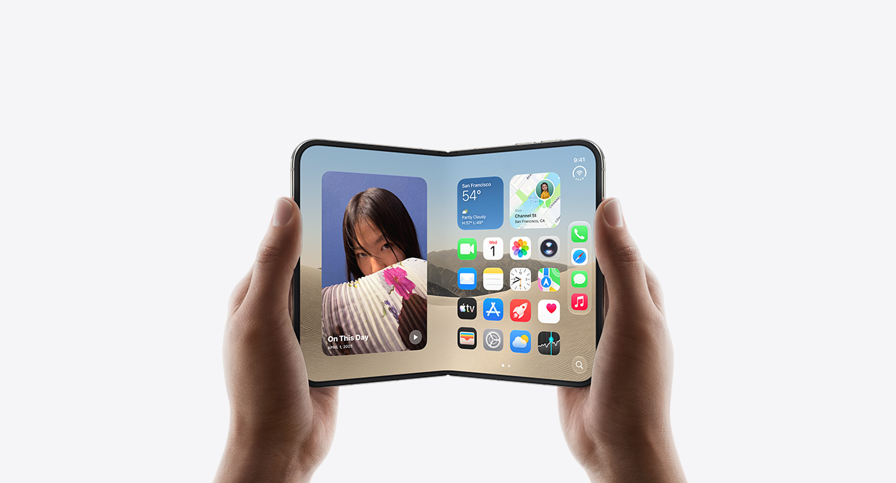 iPhone Duo, held by two hands in open landscape position, inside exterior, Star White color, iOS home screen display, photos on the left, apps on the right