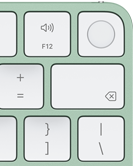 Klawiatura Magic Keyboard, prawy górny róg, kolor zielony, czytnik Touch ID, klawisz Delete i klawisze regulacji głośności